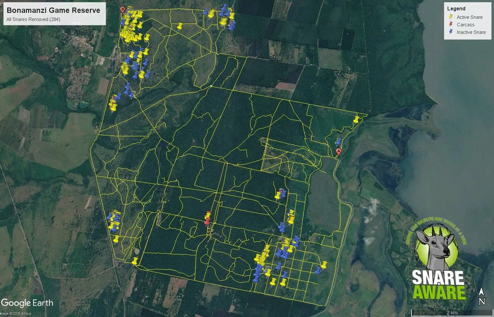 Satellite map of Bonamanzi Game Reserve with pins marking 284 removed snares, clustered along the reserve boundary