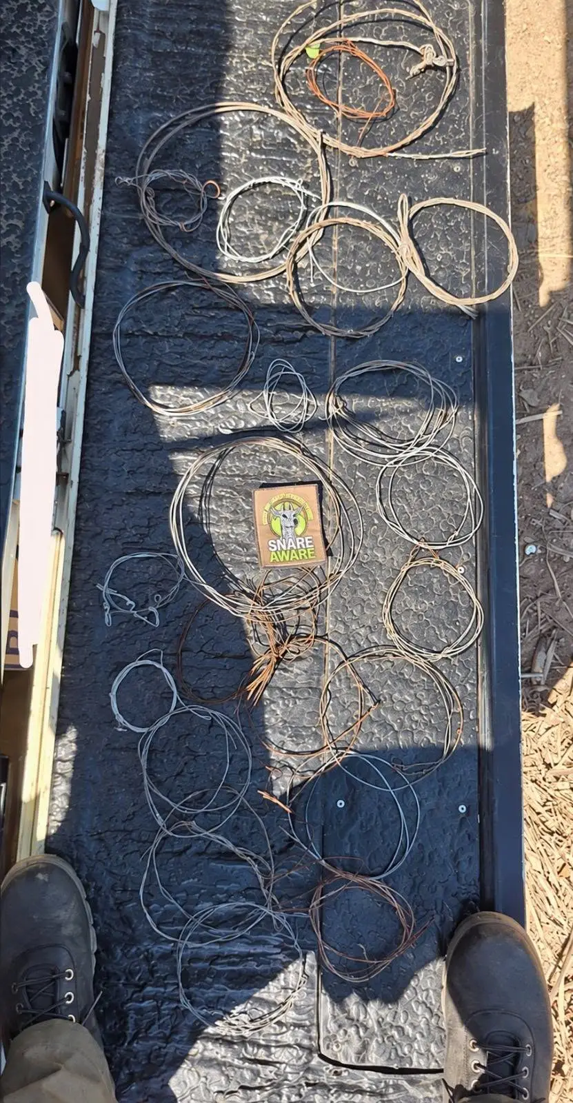 21 wire snares loaded onto the tailgate of the sweep patrol vehicle